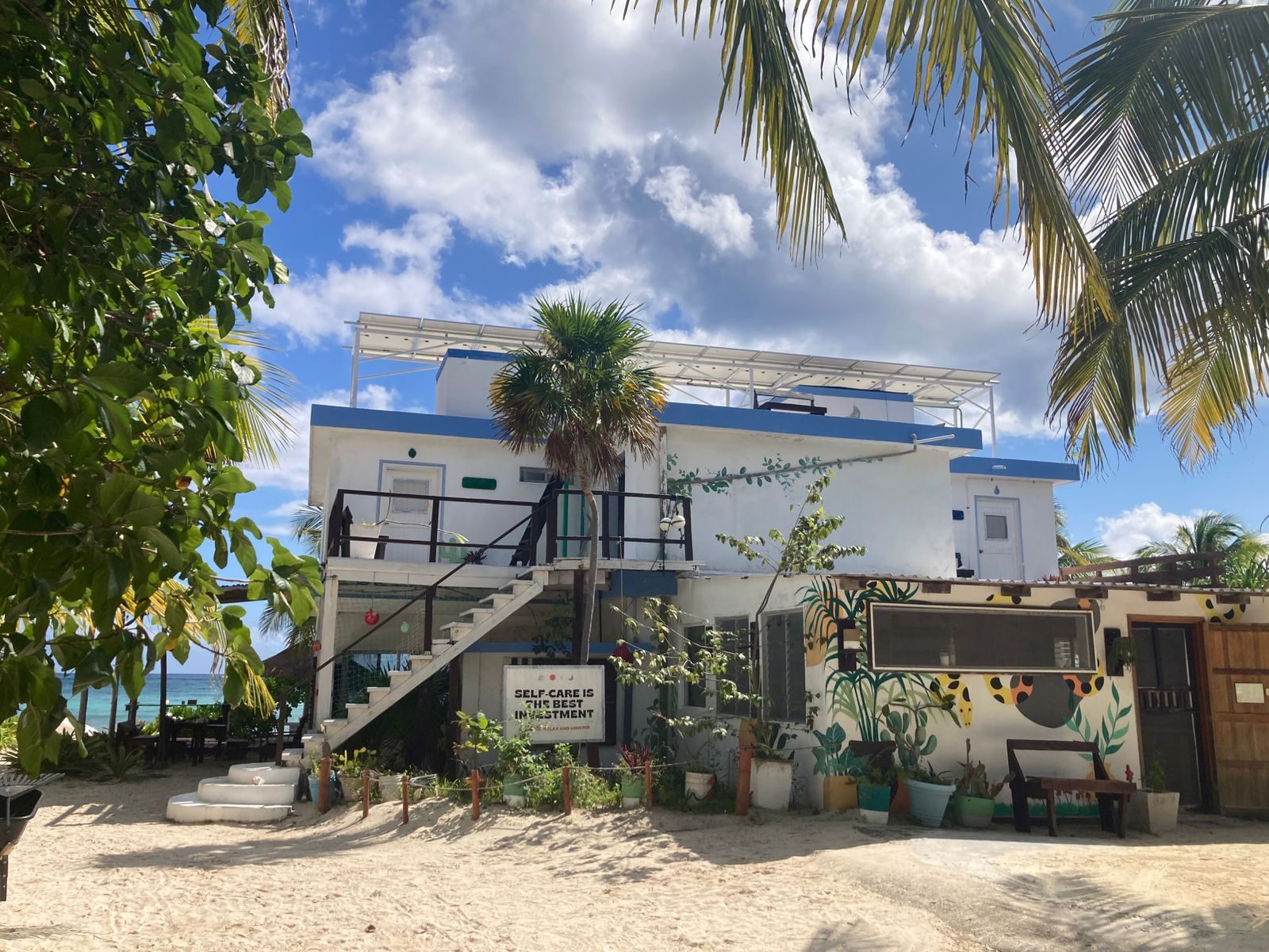 Pronoia — solar panels on the rooftop, beach side view